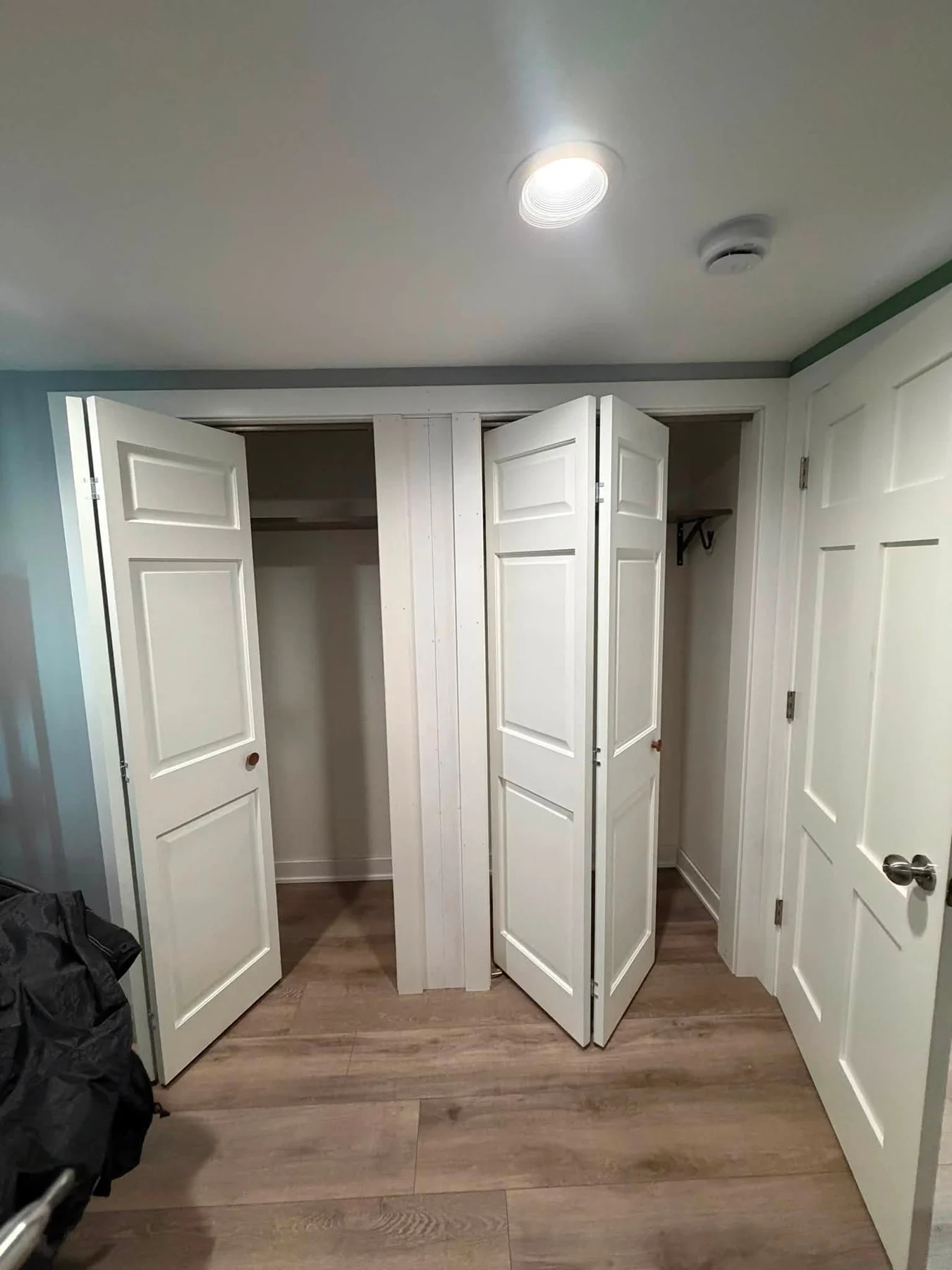 Finished double closet with white doors