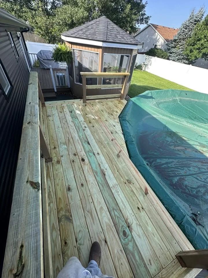New deck boards around backyard pool